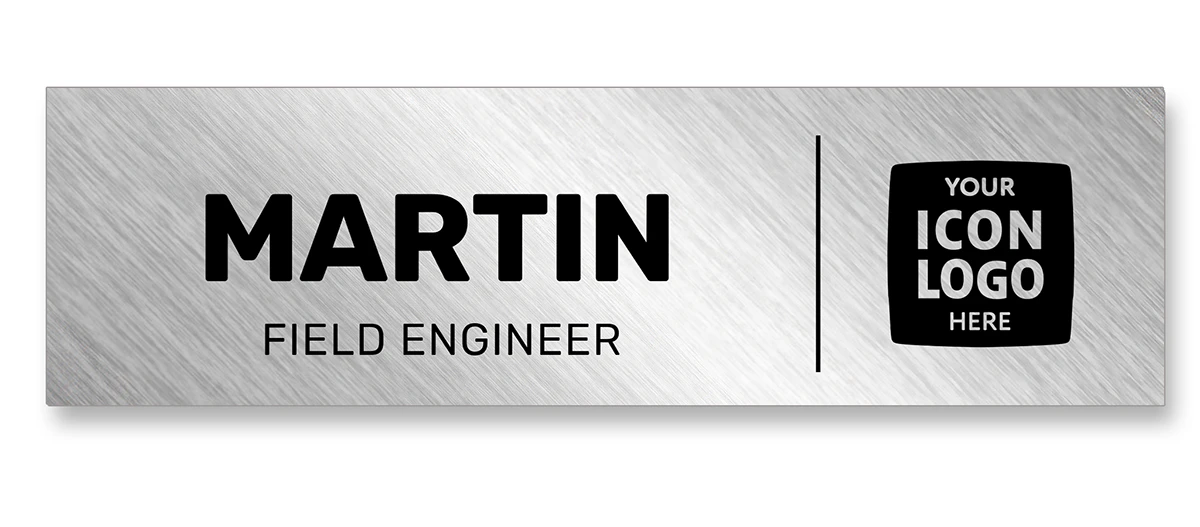Brushed silver metallic name tag with diagonal highlight, company icon, first name, and job title