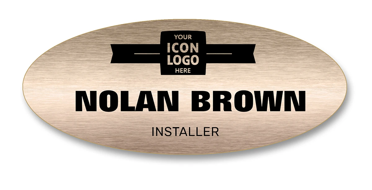 Wide brushed bronze oval name tag with company logo banner, employee name, and job title — wingsteps