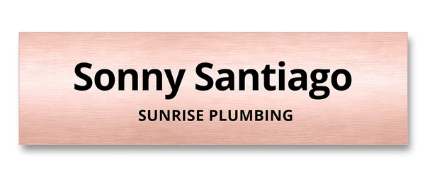 Brushed rose gold metallic name tag with bold minimal typography — designed by Debbie Alane, wingsteps